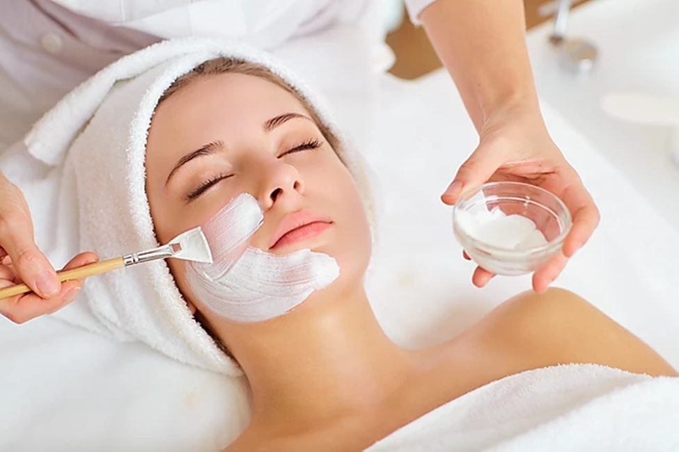 A woman being pampered with GEN's Anti-aging Body Lotion on a white background